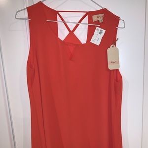 Lost April papaya colored sleeveless blouse
